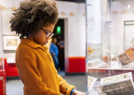 Children interacting with fairy tale themed exhibits at the British Library