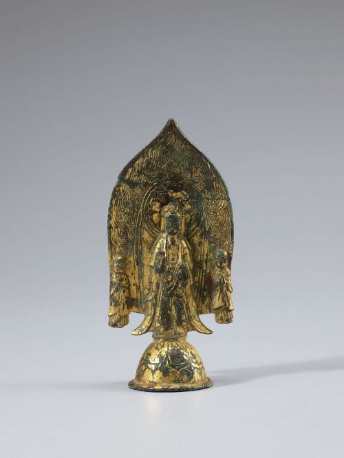 Gilt-bronze Bodhisattva triad sharing a flame-shaped halo, Korea, AD 500–600