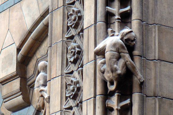 Architectural detail with monkey sculpture on the façade of the Natural History Museum