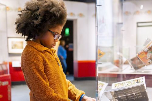 Children interacting with fairy tale themed exhibits at the British Library
