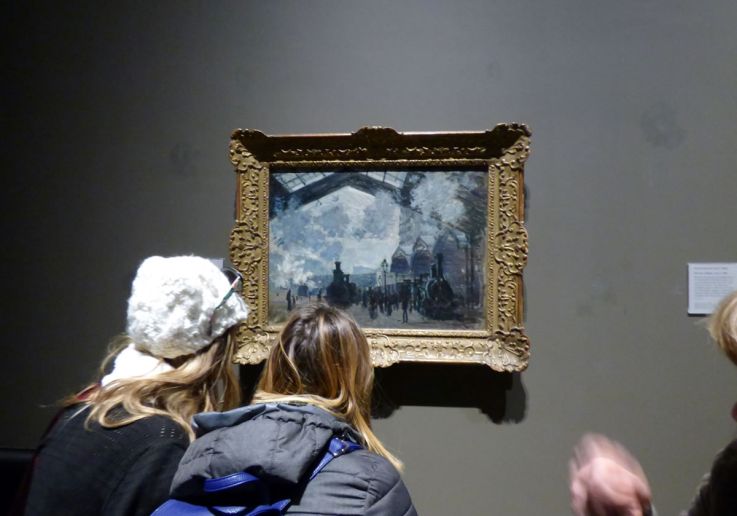 Visitors engaged in a private tour of the National Gallery with a personal guide