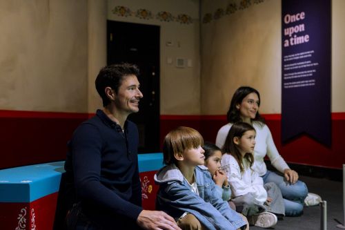 Visitors enjoying the Fairy Tales exhibition at the British Library