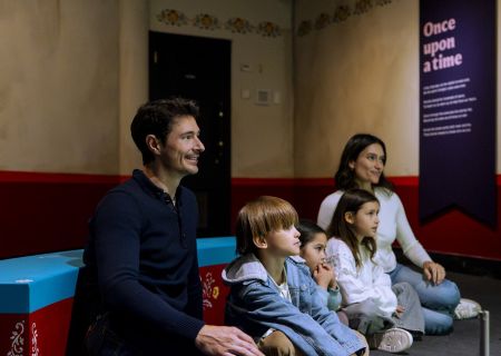 Visitors enjoying the Fairy Tales exhibition at the British Library