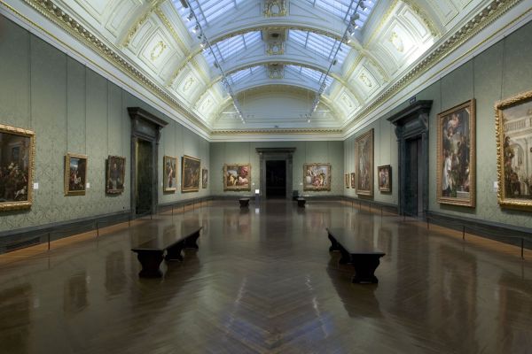 Spacious hall with skylight ceiling and artworks at the National Gallery in London.
