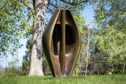 Henry Moore Large Two Forms displayed outdoors at Kew Gardens London