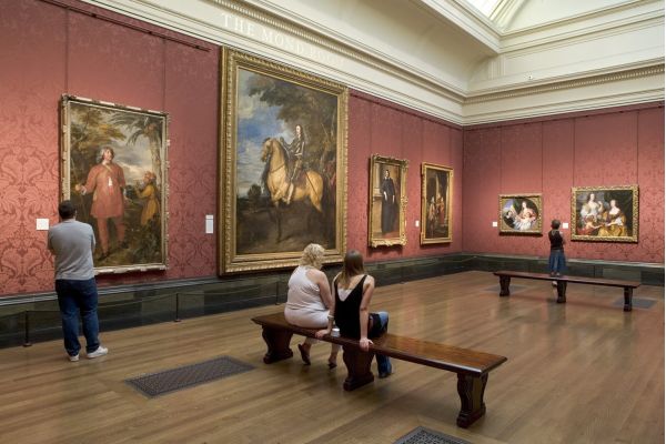 Interior gallery with people viewing classical paintings at the National Gallery in London @ National Gallery
