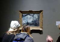 Visitors engaged in a private tour of the National Gallery with a personal guide