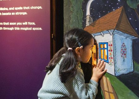 Children exploring interactive displays at the Fairy Tales exhibition at the British Library