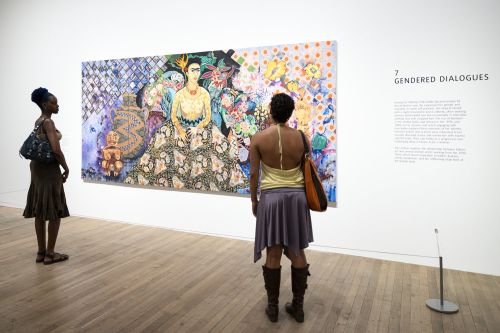 Visitors exploring the Frida Kahlo exhibition at Tate Modern