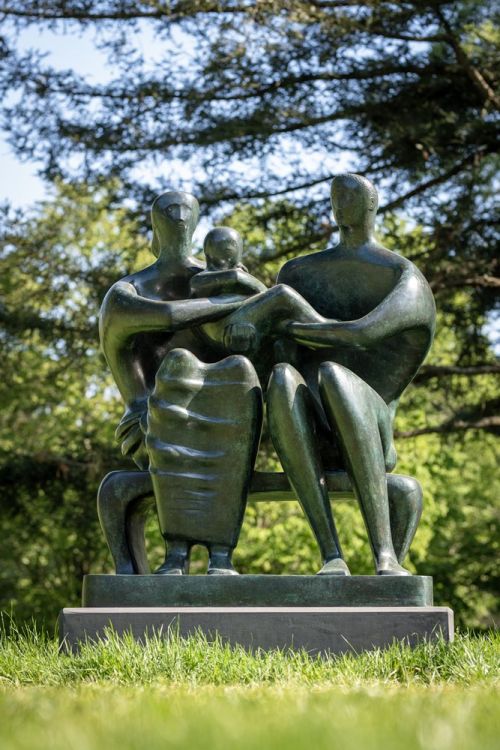 Henry Moore Family Group bronze sculpture in the gardens at Kew