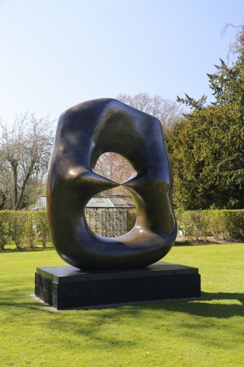 Henry Moore Oval with Points sculpture framing the landscape at Kew Gardens